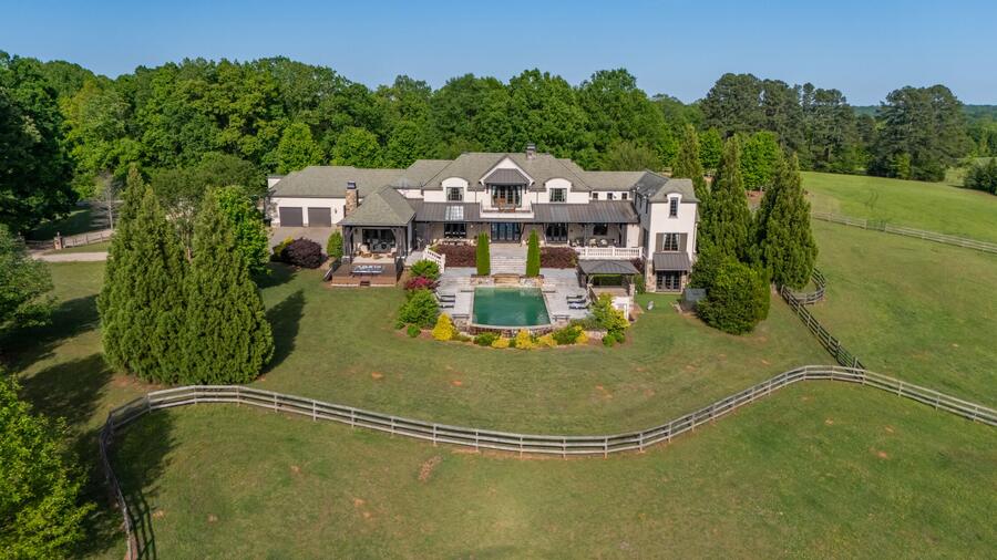 Aerial of the residence, pool and pasture fencing