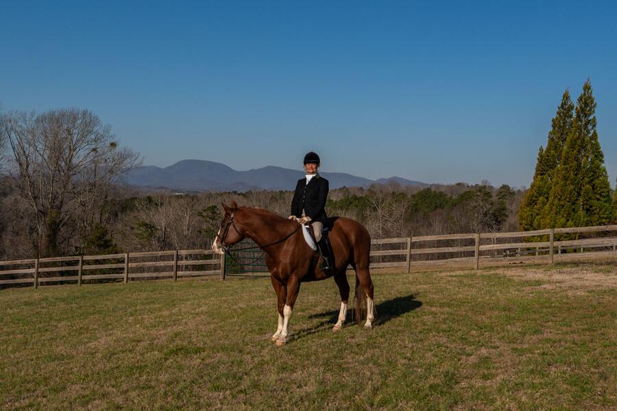 A rider with the mountains beyond
