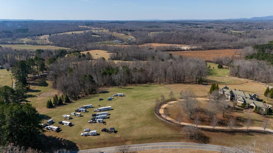 Aerial of the meet with trailers in the field